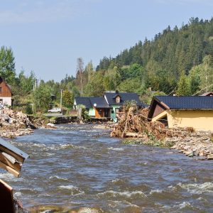 flood damaged houses by a river