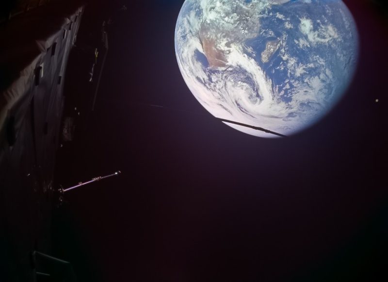 Image of Earth taken by the JMC-1 camera on the Juice spacecraft during the flyby of Earth on 28 September 2026. Also shows part of the spacecraft in the foreground.