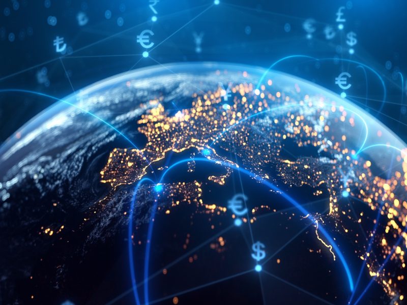 View of Europe and the Earth from above with blue lines symbolising international communications links and currency symbols